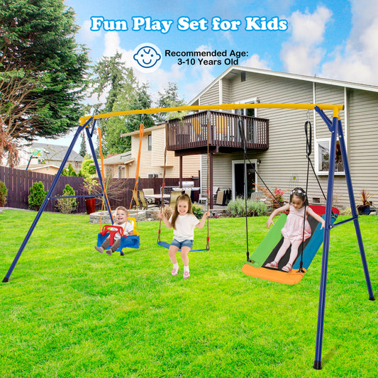 The swing set positioned on a green lawn in front of a house with children playing on the seats
