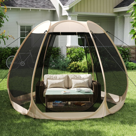 The screened camping tent gazebo set up on grass with outdoor furniture inside