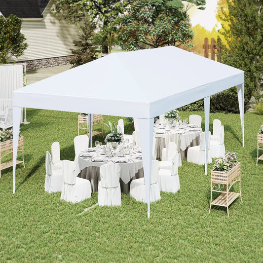 The white pop up canopy tent set up for an outdoor event with tables and chairs