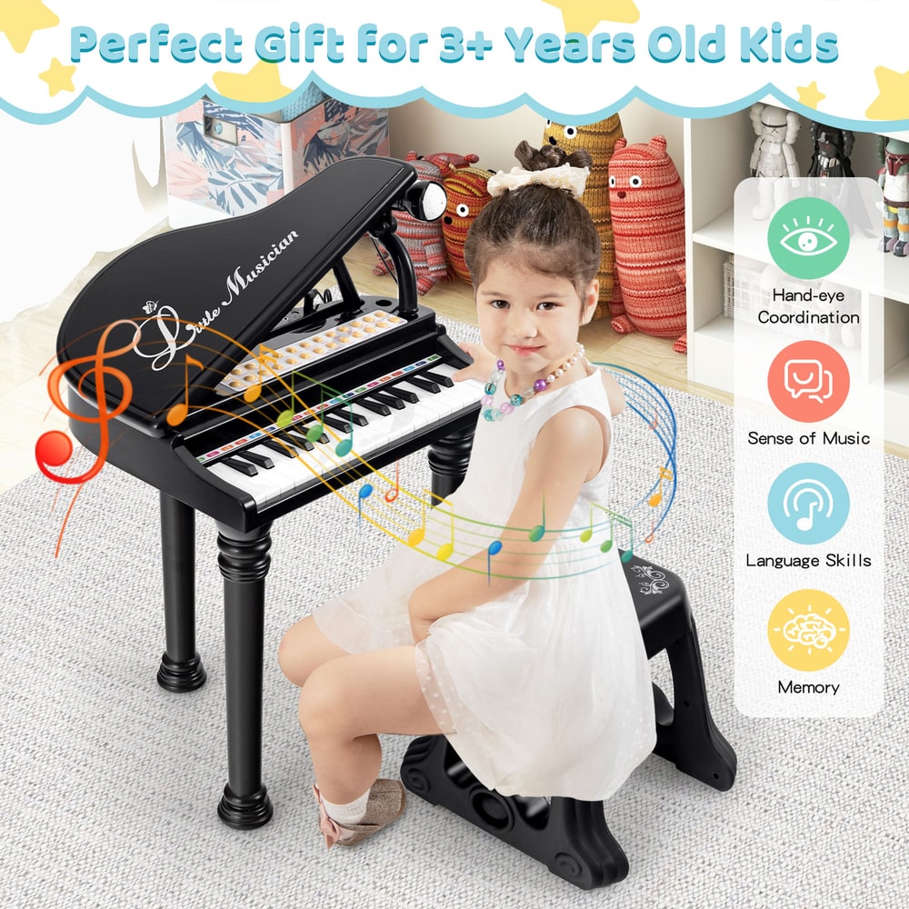 A child sits on the stool playing the black toy piano, presented as a gift for kids
