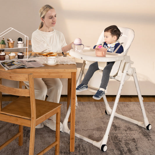 The baby high chair in use with a toddler sitting at a dining table