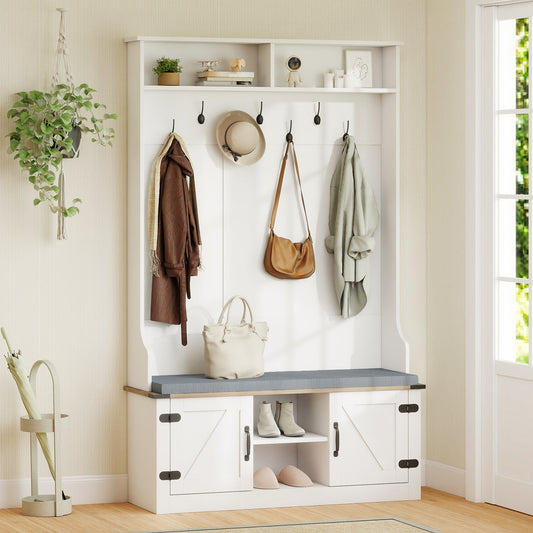 The coat rack and hall tree is shown in a room with a plant and umbrella stand