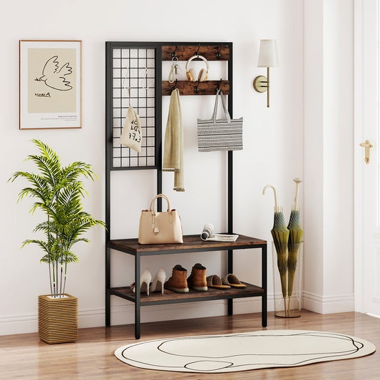 Coat rack and shoe bench with hanging bags, coats and shoes in a hallway