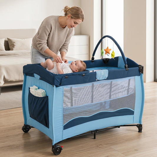 A mother places a baby into the blue baby playpen and playard with a changing table attachment