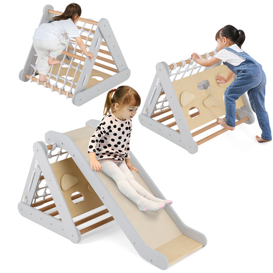 the climbing frame being used by children to climb the net, the wall and slide down the ramp