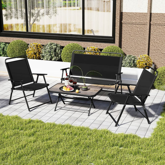 Black outdoor conversation set with two chairs and loveseat arranged on a patio