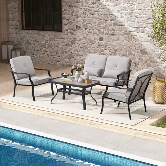 The patio furniture set arranged on a patio next to a swimming pool