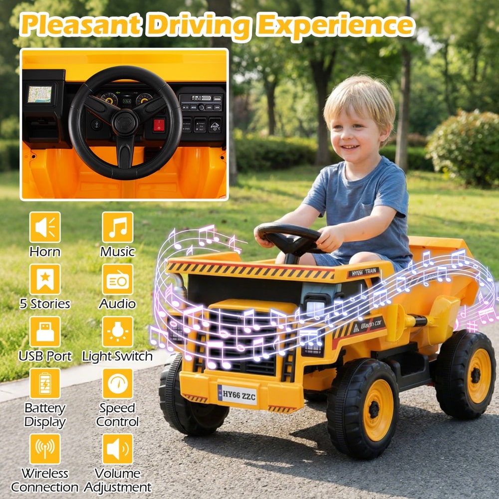Close up of the dashboard and steering wheel of the yellow and black ride-on truck