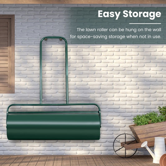 The green steel lawn roller hanging on a brick wall for easy storage