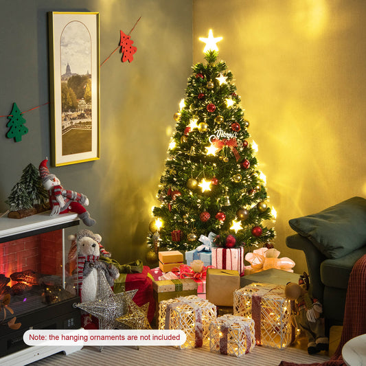 The fibre optic Christmas tree is decorated with baubles and gifts in a cosy room setting