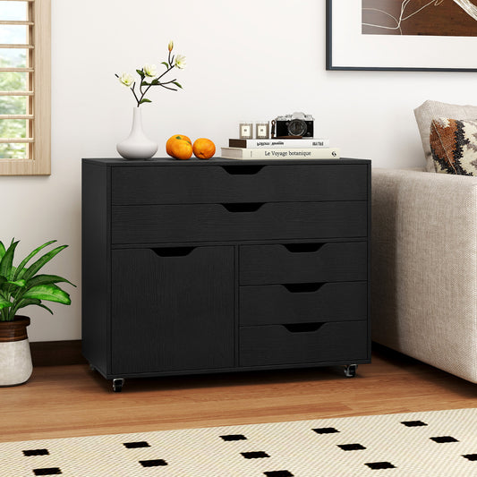 The black cabinets and chests shown in a living room setting next to a sofa