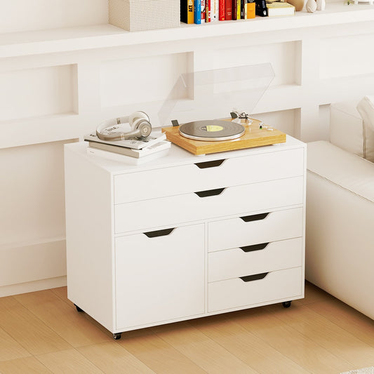 The white mobile chest placed in a living room with a record player and headphones on top