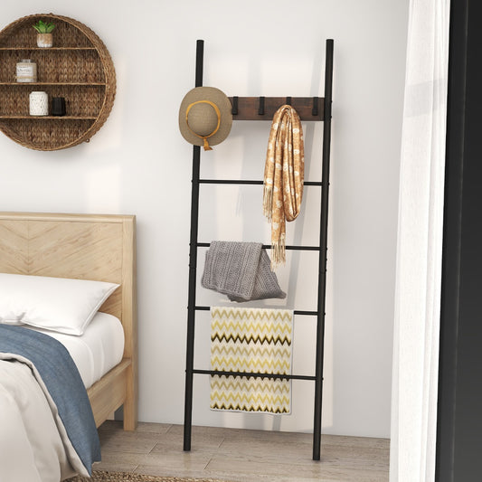 The coat rack and hall tree in a bedroom, holding blankets and a hat