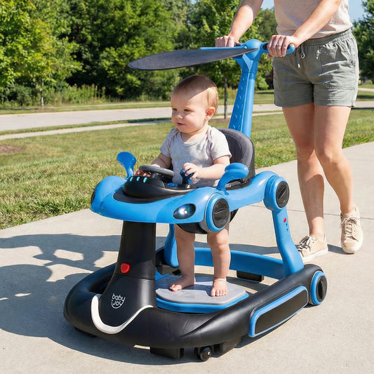 A baby sits in the navy blue push car being pushed by an adult outdoors