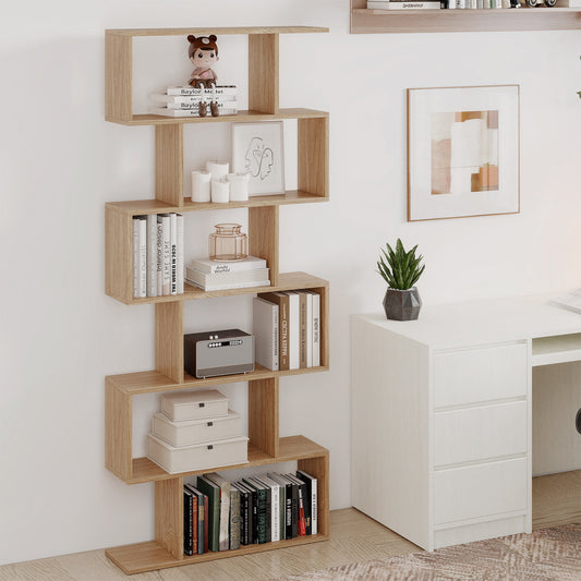 The S-shaped wooden bookcase filled with books and decorative items next to a desk