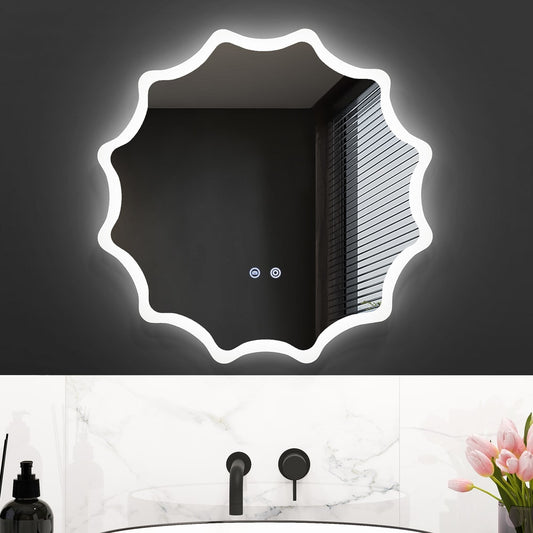 The illuminated round wall mirror with a waved edge is lit up in a bathroom