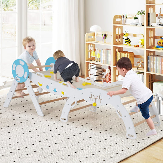 Three toddlers playing on the white climbing frame in a bright room