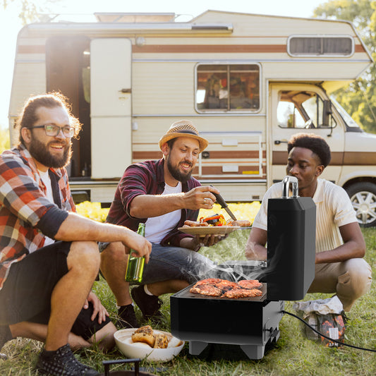 Three men enjoying food cooked on the portable pellet grill outdoors by a campervan