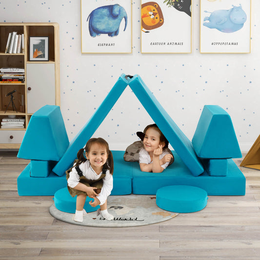 two children playing with the green foam kids sofa arranged into a tent shape in a nursery