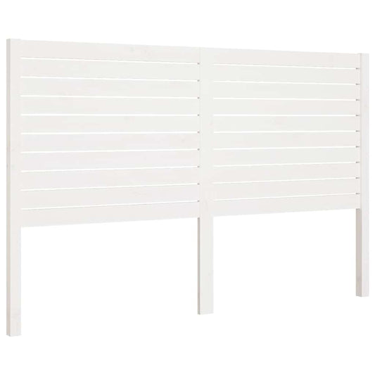 White slatted bed headboard standing against a plain background