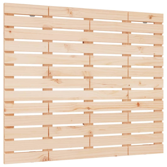 A close-up view of the slatted wooden headboard, showing the natural pine wood grain