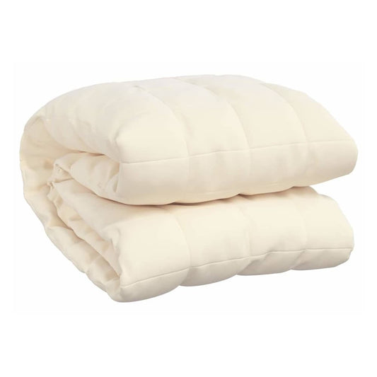 The weighted blanket folded in half to show the soft fabric and quilted texture