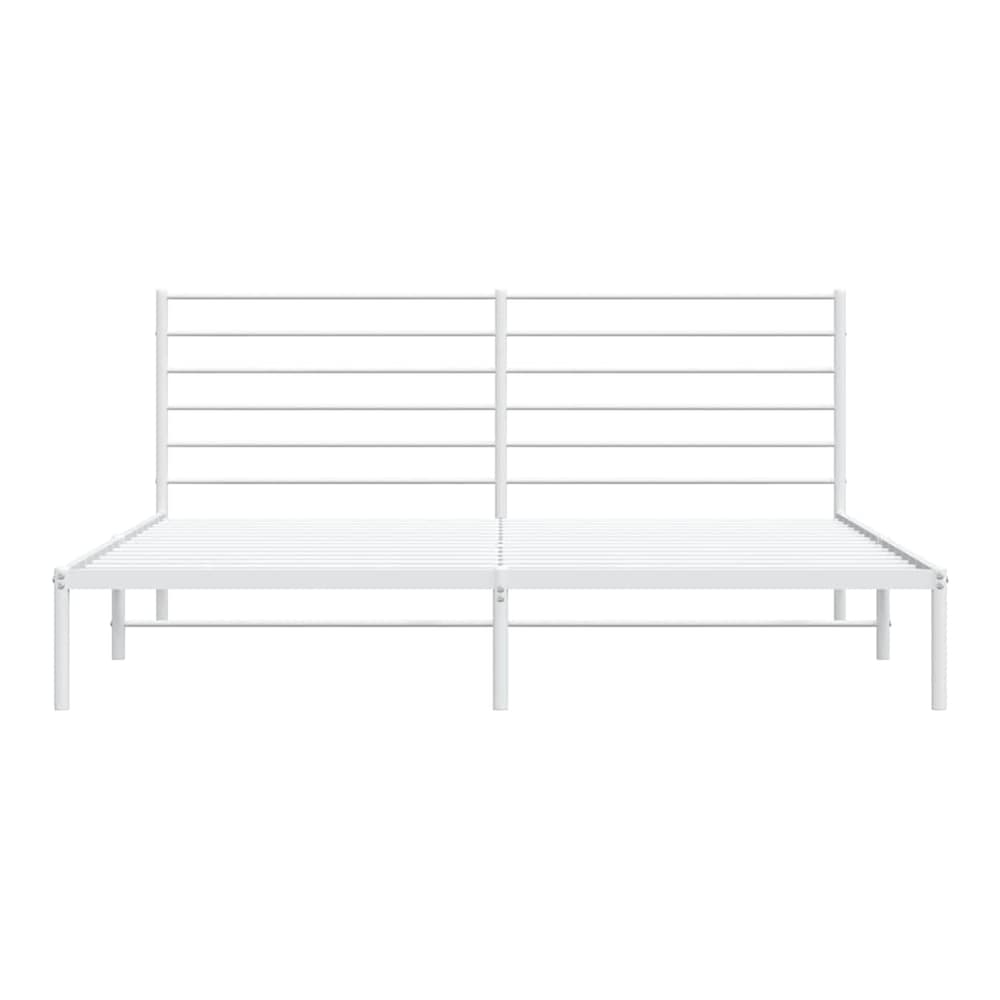 The white metal bed frame from the front