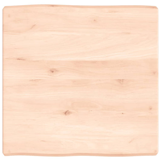 Untreated solid wood live edge table top showing natural grain and live edge detail