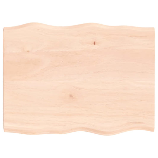 The wooden table top has a natural live edge with a wavy shape