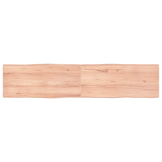 The rectangular wooden table top seen from directly above showing the natural grain pattern