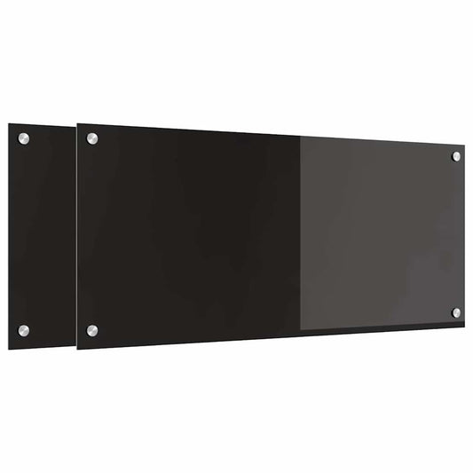 Two black tempered glass kitchen backsplashes side by side