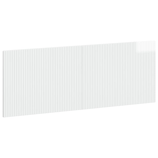 The wall-mounted headboard shown from a high angle to display its glossy white ribbed surface