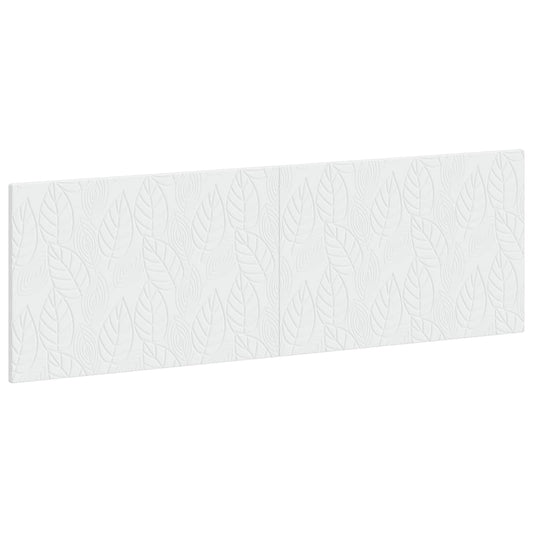 The white wall-mounted headboard with a leaf pattern shown from a high angle