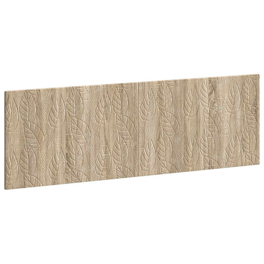 The wall-mounted headboard with a textured leaf pattern shown from an angled perspective