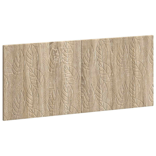 The wall-mounted headboard shown from an angled perspective revealing the leaf pattern texture