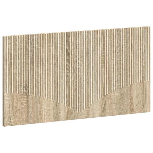 The wall-mounted headboard has a ribbed texture on the top half and a wood grain effect on the bottom
