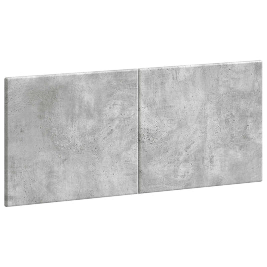 A close-up view of the concrete grey engineered wood headboard