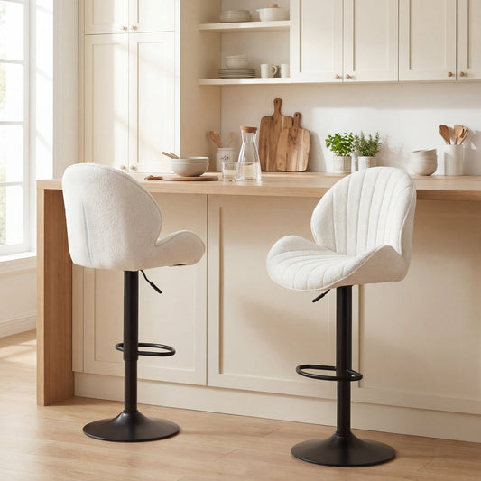 Two cream bar stools with backs and footrests in a modern kitchen setting