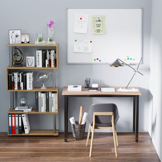 The office desk is set up in a room with a chair and a bookshelf