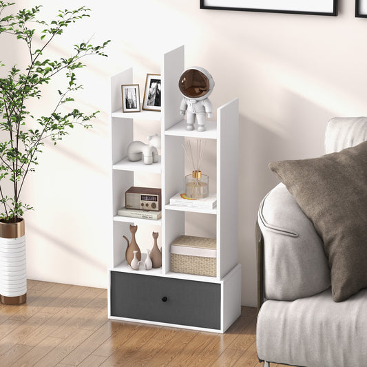 The white bookcase placed in a living room next to a sofa with various ornaments on shelves