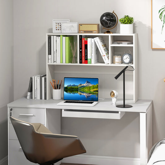 The white bookcase is shown on a desk with books and a laptop