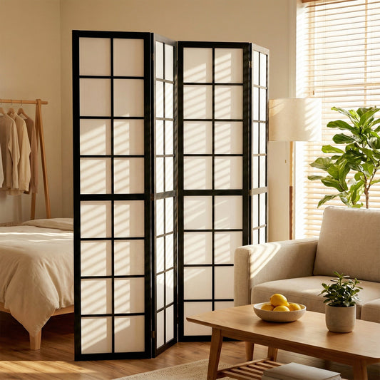 the room divider placed in a living room next to a sofa and a bed, creating a private area