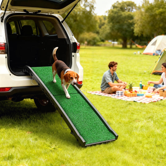 The portable dog ramp in use, with a beagle dog walking up it into the back of a car
