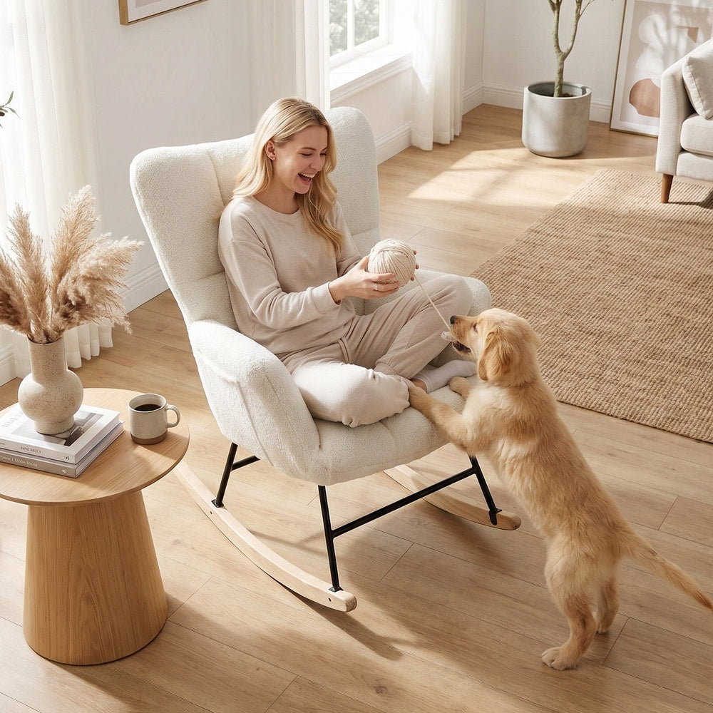 The rocking chair with a woman playing with a puppy in a light and airy living room