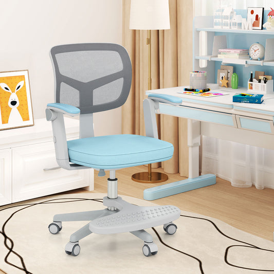 The children study chair in a child's room next to a desk with books and art supplies