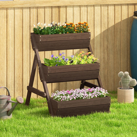 A wooden tiered planter filled with flowers and plants, set against a fence