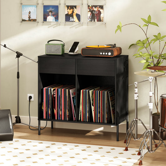 The black end table in a living room with a record player, speaker, and plant