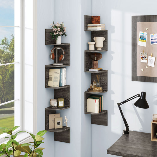 Two grey 5-tier corner shelves in a room with books and decorative items