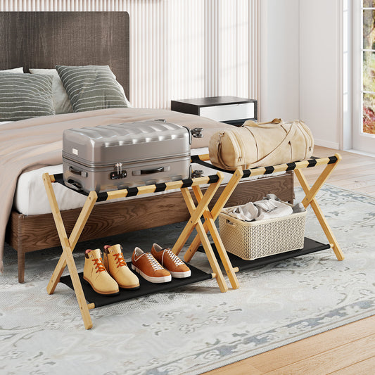 The luggage racks placed at the end of a bed in a bedroom with suitcases and storage baskets