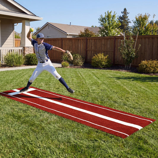 The softball training aid in use on a green lawn with a player pitching